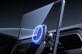 A magnetic stand holding a tablet in a car.