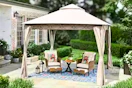 Lifestyle image of a tan soft top gazebo in an outdoor setting