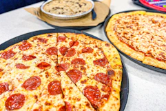 Two Chuck e Cheese pizzas.