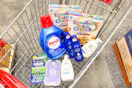 gillette and venus razors, dove hand wash, persil detergent, nivea lotion, and cinnamon toast crunch cereal in a cart