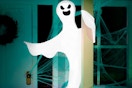 a halloween ghost outside of a home