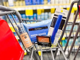 revlon foundation, neutrogena wipes, maybelline eyeshadow, and covergirl mascara in a cart