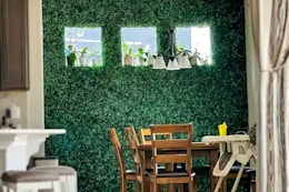 Lifestyle image of the 24-piece Boxwood Faux Hedge Panels displayed on wall in home