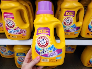 hand holding arm hammer detergent