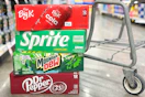 kroger soda 12 packs in store floor by shopping cart