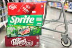 kroger soda 12 packs in store floor by shopping cart