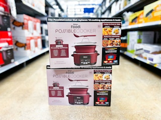 two ninja foodi possible cookers stacked on floor in walmart aisle