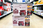 two ninja foodi possible cookers stacked on floor in walmart aisle