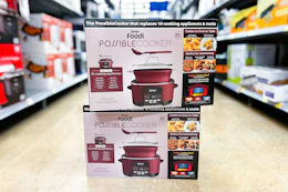 two ninja foodi possible cookers stacked on floor in walmart aisle