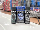 3 axe body sprays together in front a walmart cart