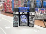 3 axe body sprays together in front a walmart cart