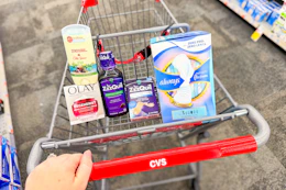 person pushing a cart with old spice deodorant, olay moisturizer, zzzquil products, and always pads