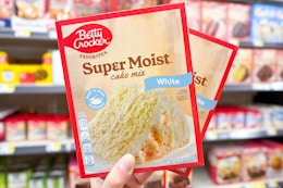 hand holding up betty crocker cake mix