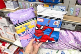 hand holdinglicensed character fleece pajamas