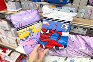 hand holdinglicensed character fleece pajamas