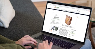 a person looking at the woot website on their macbook