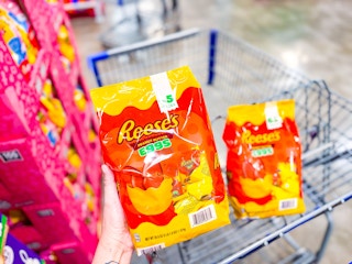 hand holding a bag of reeses eggs