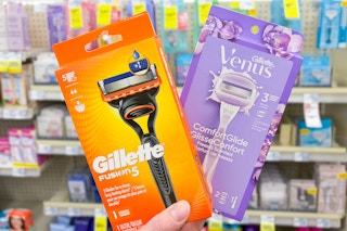 person holding gillette and venus razors