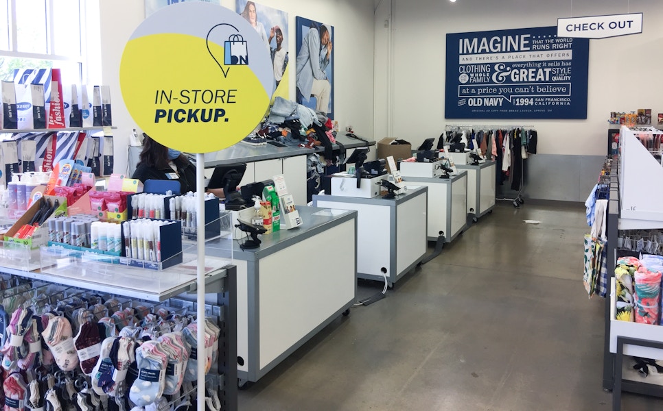 A sign inside an Old Navy store indicating the location for Online order pick-up.