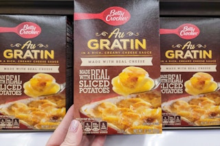 hand holding a box of betty crocker casserole potatoes at kroger