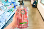 hand holding Herbal Essences shampoo