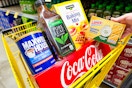 clover valley, pure leaf, maxwell house, coca-cola, lance products in a yellow dollar general shopping cart