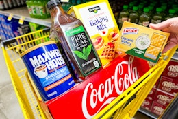 clover valley, pure leaf, maxwell house, coca-cola, lance products in a yellow dollar general shopping cart