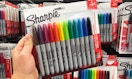 hand holding colored sharpie multipack at staples
