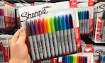 hand holding colored sharpie multipack at staples