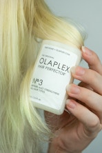 hand holding Olaplex Hair care