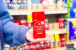 person holding an old spice deodorant