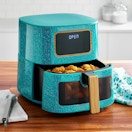stock image of a teal air fryer on a counter