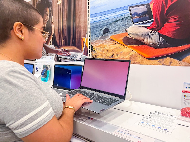 Someone shopping for laptops at Target