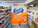 hand holding scott toilet paper in walgreens