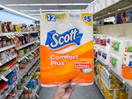 hand holding scott toilet paper in walgreens