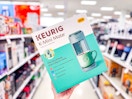 hand holding a keurig k-mini mate in a target aisle
