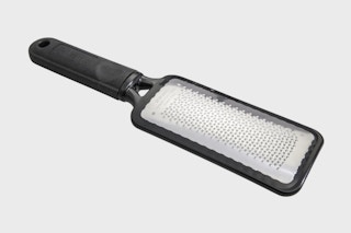 a foot file on a grey background