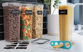 four tall food containers and labels