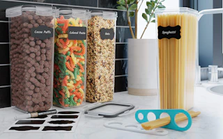 four tall food containers and labels