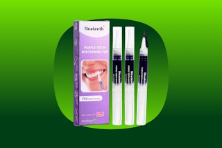 A box and three pens designed to whiten teeth, with dark purple solution inside