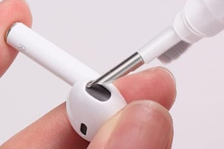 someone cleaning an AirPod