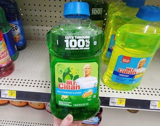 hand holding a bottle of mr clean