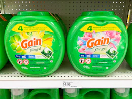 two containers of Gain detergent on a shelf