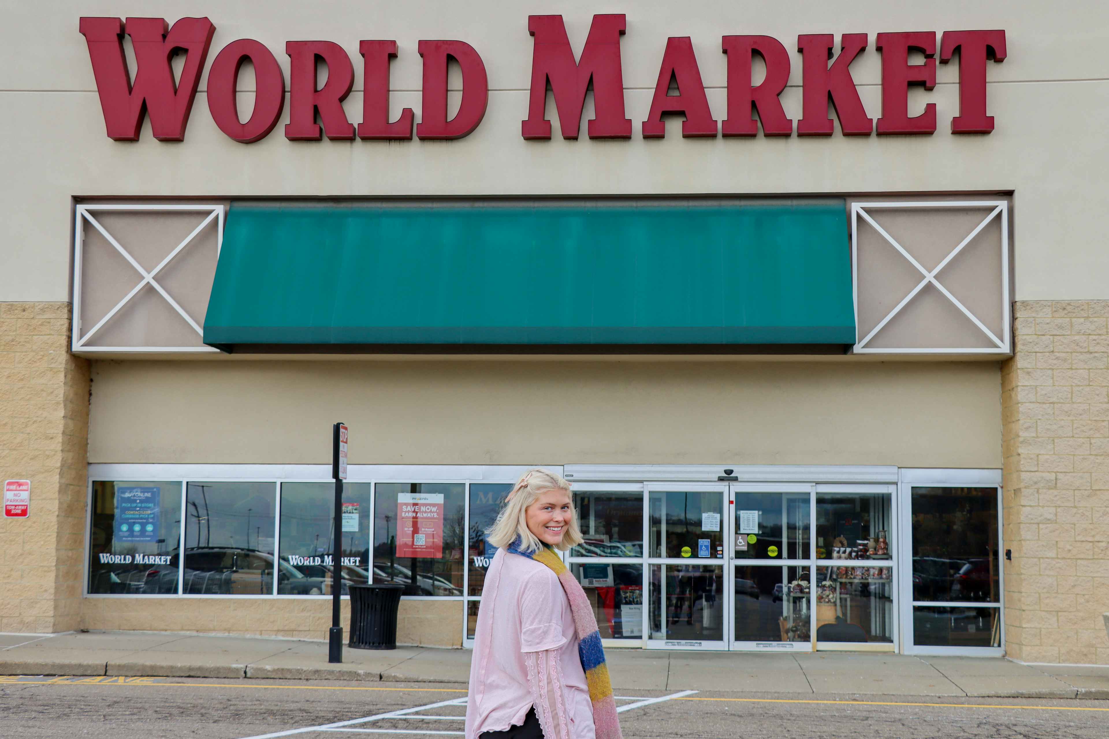 a woman outside world market 