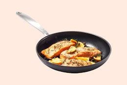 an oxo frying pan with fish in it