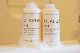 olaplex shampoo and conditioner on a tub