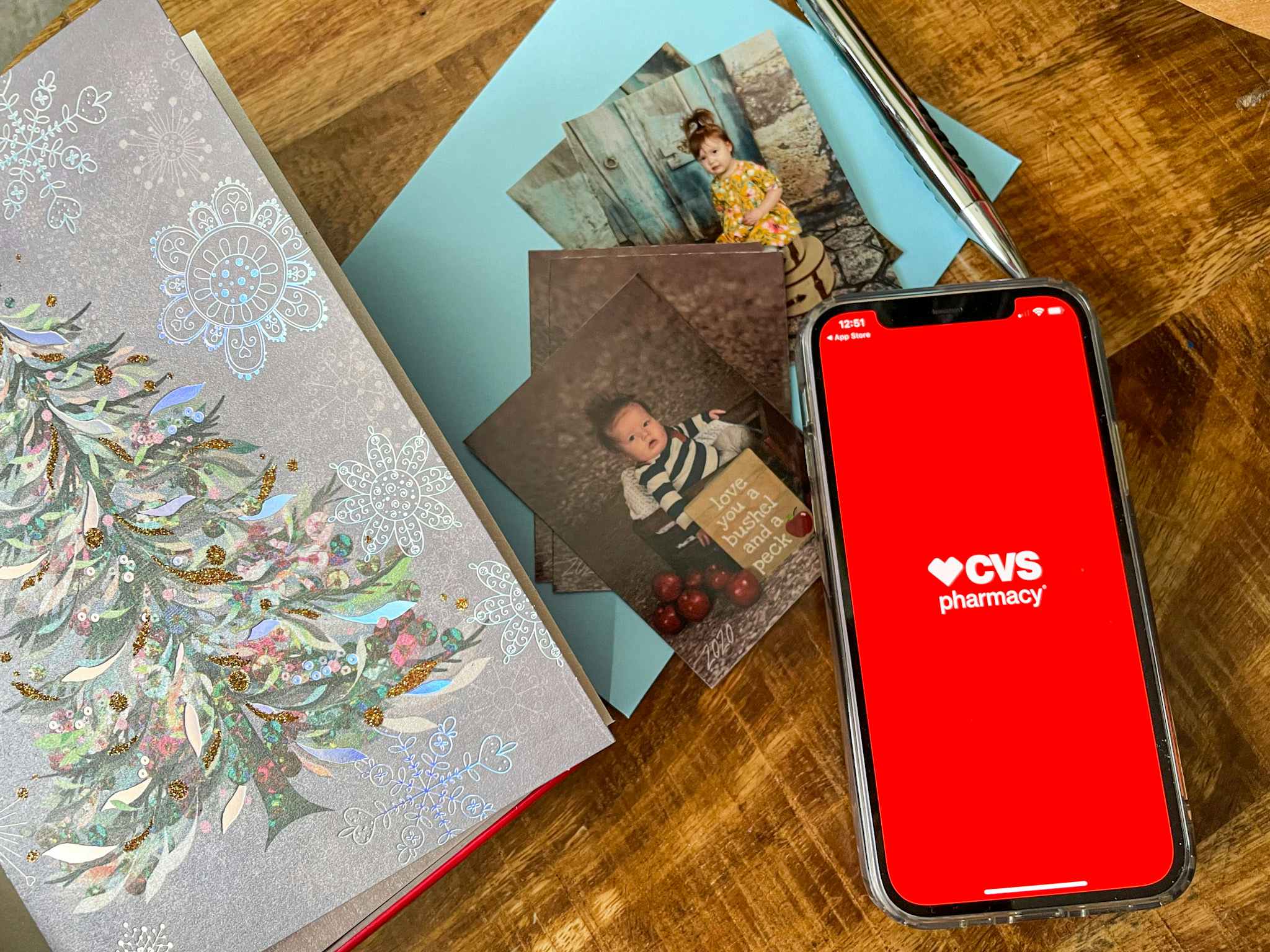 CVS app next to Christmas cards and kids school photos