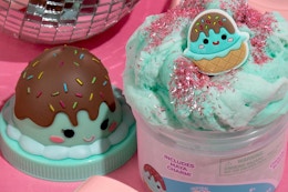 up close of Maya the ice cream slime in the container and charm
