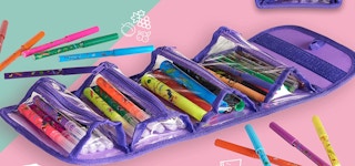 A case full of markers on a pink and green background