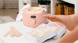 a pink waxing kit on a table